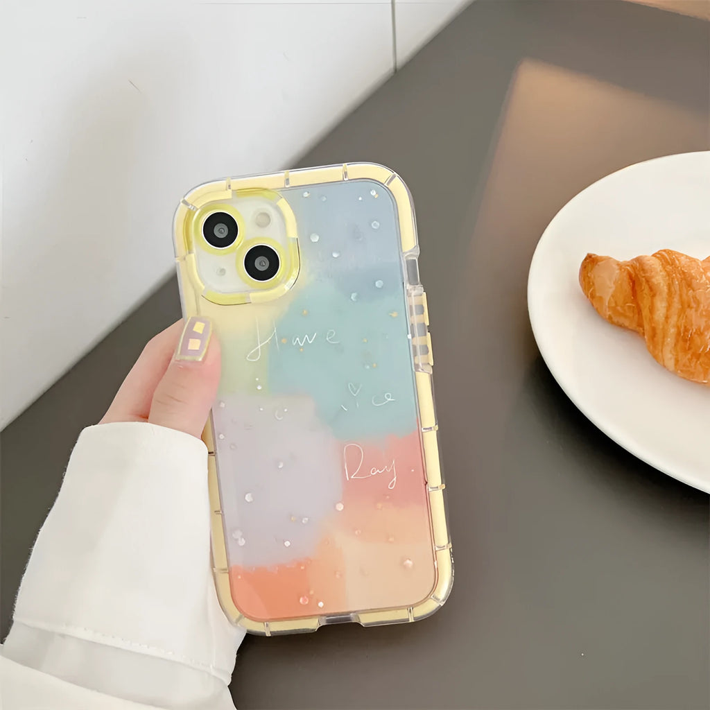 Minimalist yellow edge silicone phone case for iPhone 14 on a table.
