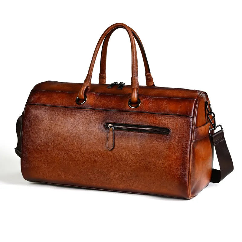 Genuine leather handmade retro travel bag in vintage brown with large capacity.