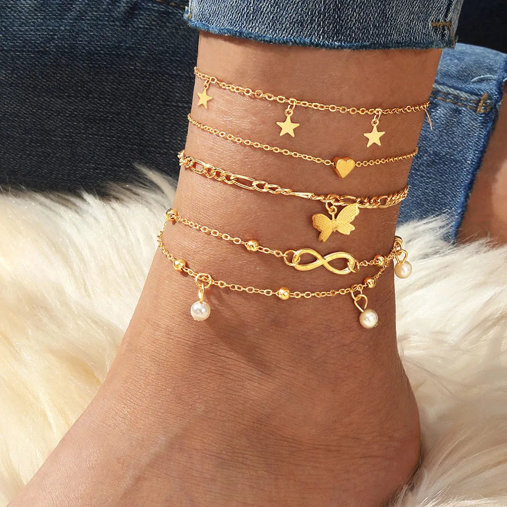 Butterfly Pearl Heart anklet 4-piece set showing layered women's ankle jewellery with charm details