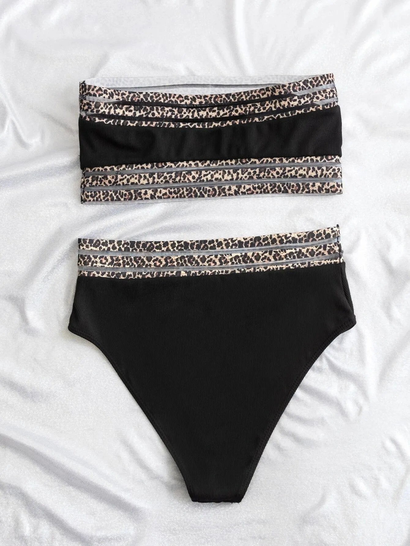 Black strapless bandeau bikini with leopard print pattern, showing front view of swimsuit