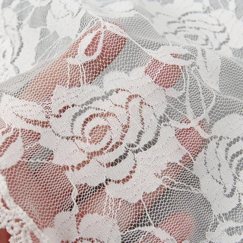 Round floral head cover for weddings measuring 30cm in black or white polyester fabric