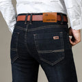 Men's slim fit elastic straight jeans in black cotton denim, full length view