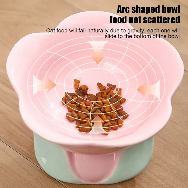 Blue ceramic raised pet bowl with floral pattern and non-slip base for cats or small dogs.