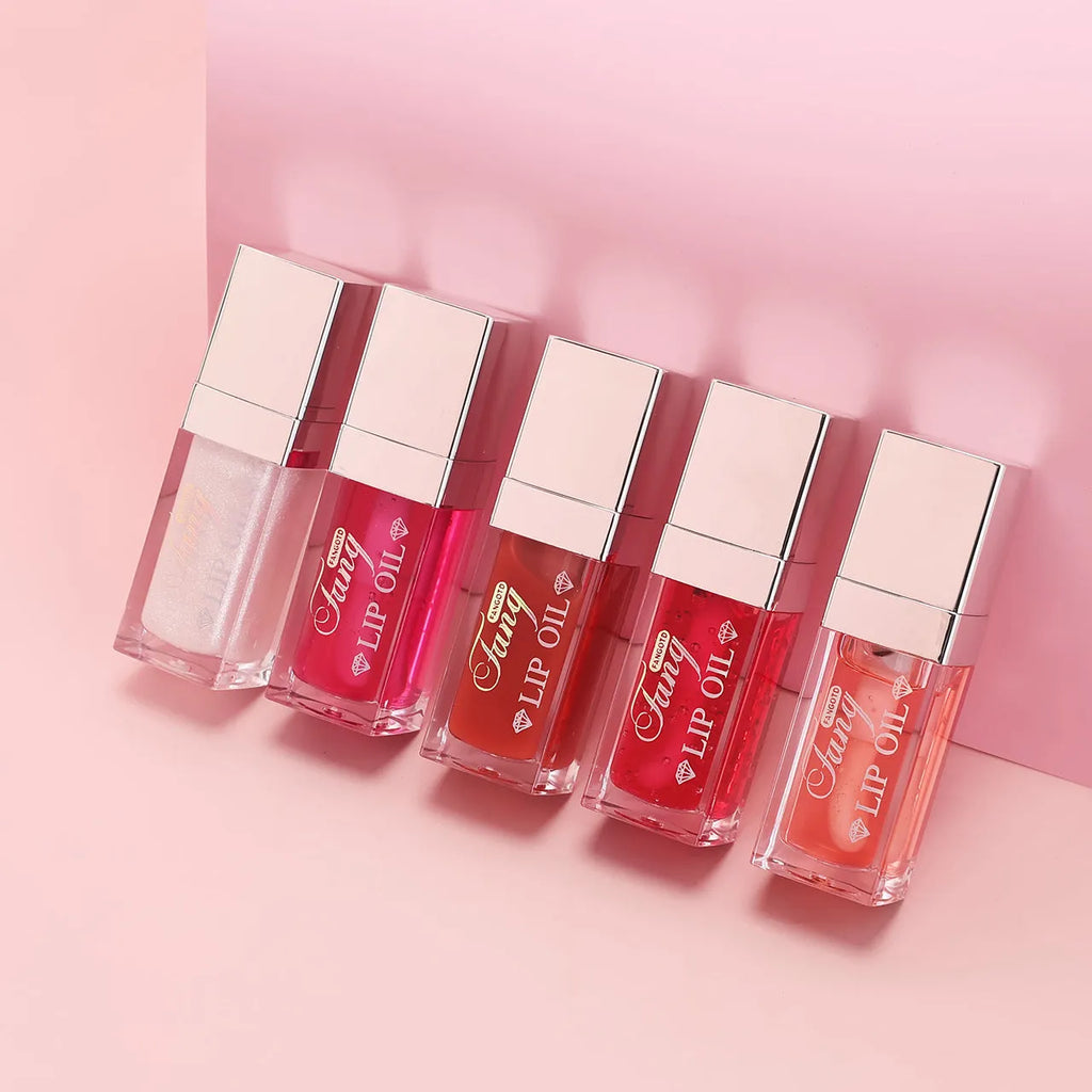 Five colour options of a bright mint lip gloss lipstick with moisturising lip essence oil.