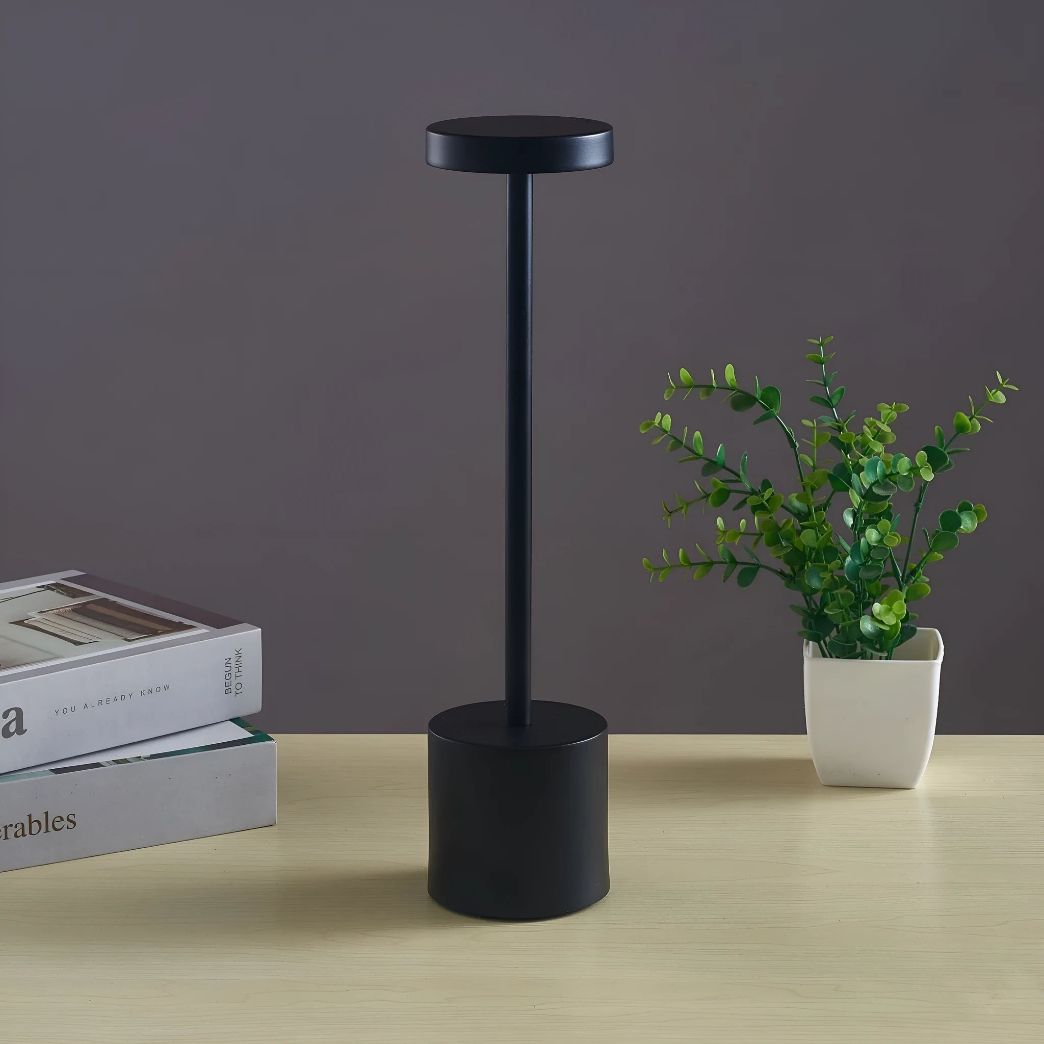 Metal touch desk lamp in gold finish with LED light on, showing compact 34x8cm size