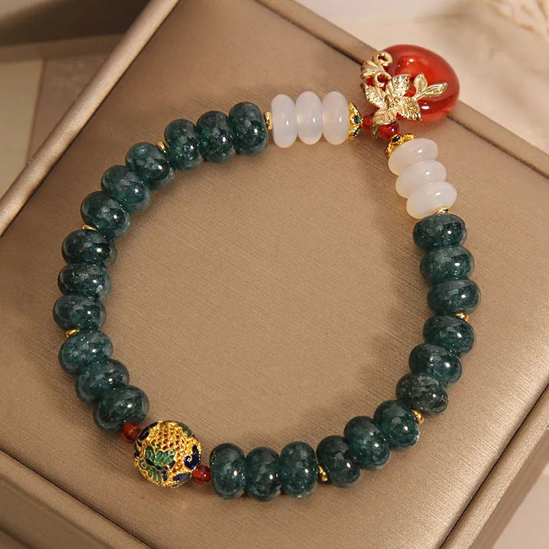 Women's crystal bracelet with blue water jade and red agate beads featuring safety buckle closure