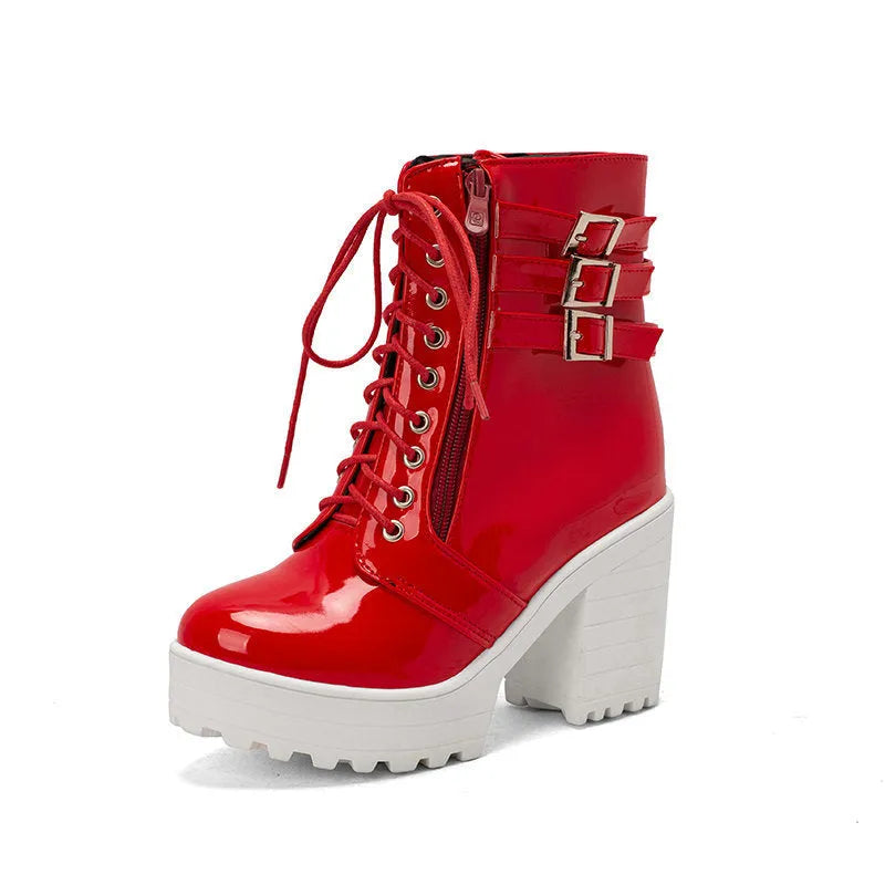 Women's black thick-heel short boots with front lace-up and round toe on a waterproof rubber sole.