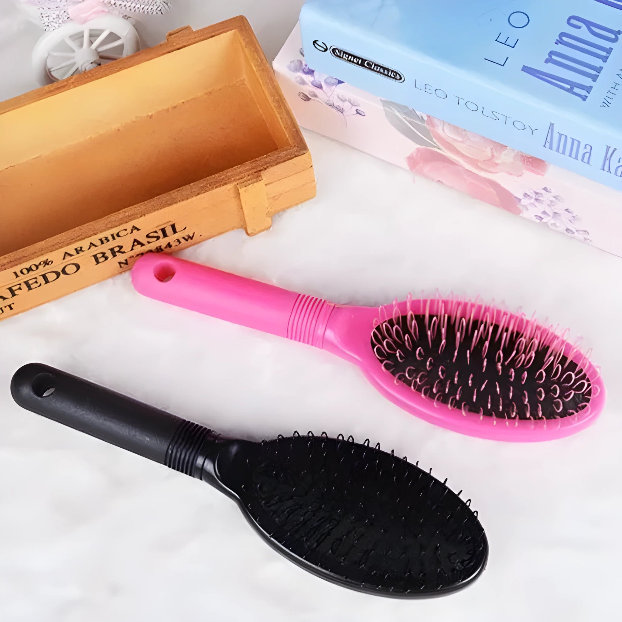 Black ring tooth hair extension comb on a white background, showing its 22cm length.