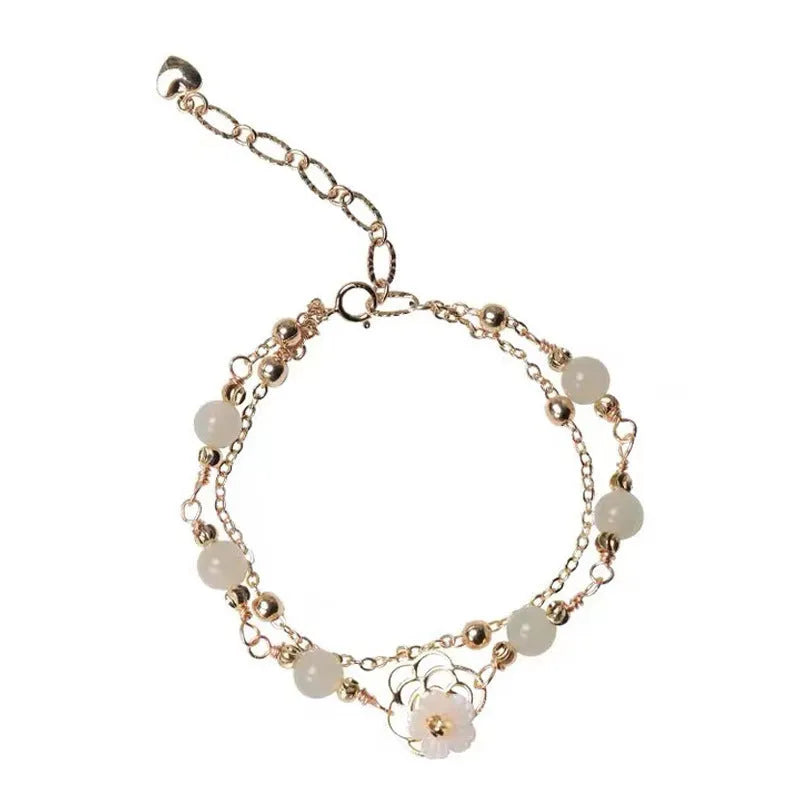 Yellow gold electroplated copper butterfly bracelet with geometric shape and bells of Ireland Hetian jade charm