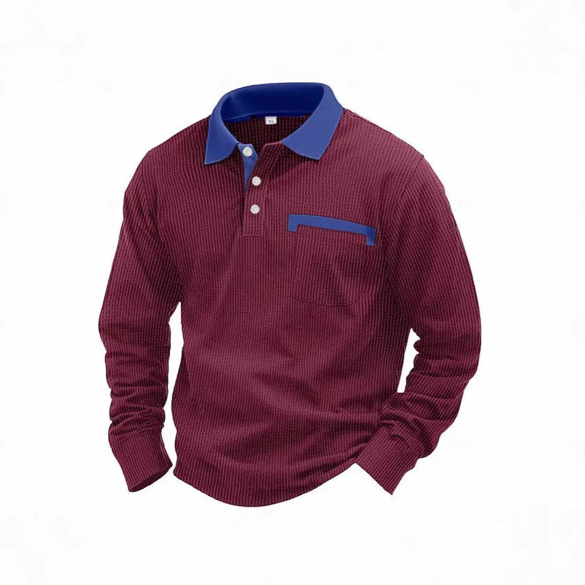Man wearing a long-sleeved waffle-texture polo shirt in a solid colour with an asymmetric design detail.