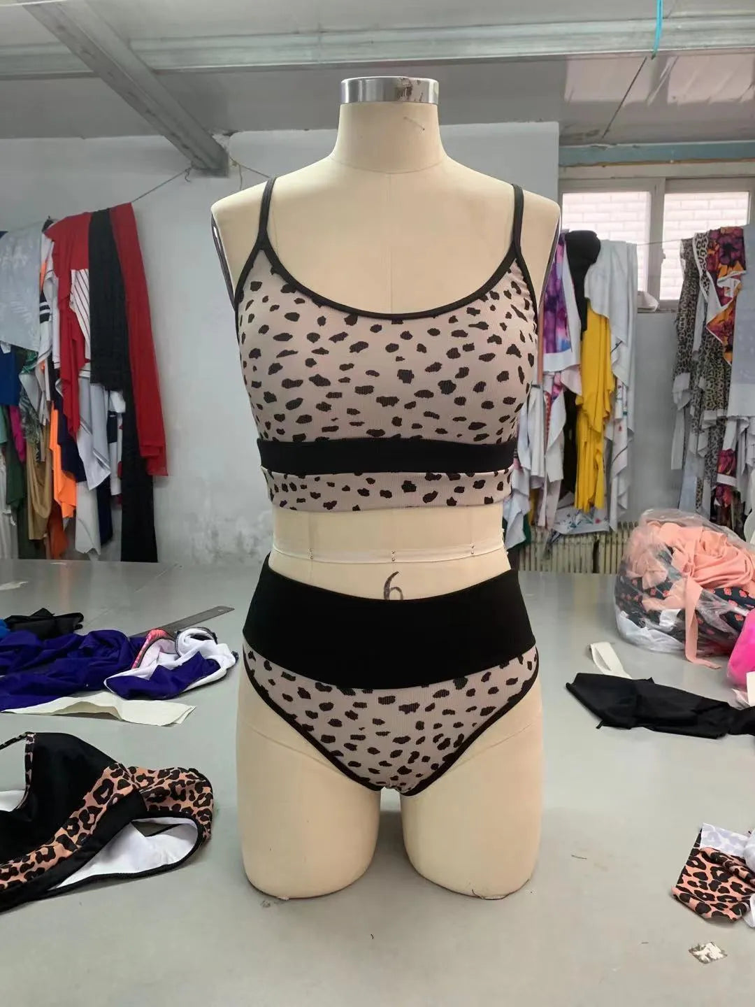 Women's high waist split bikini swimsuit in nylon fabric available in white and leopard print patterns