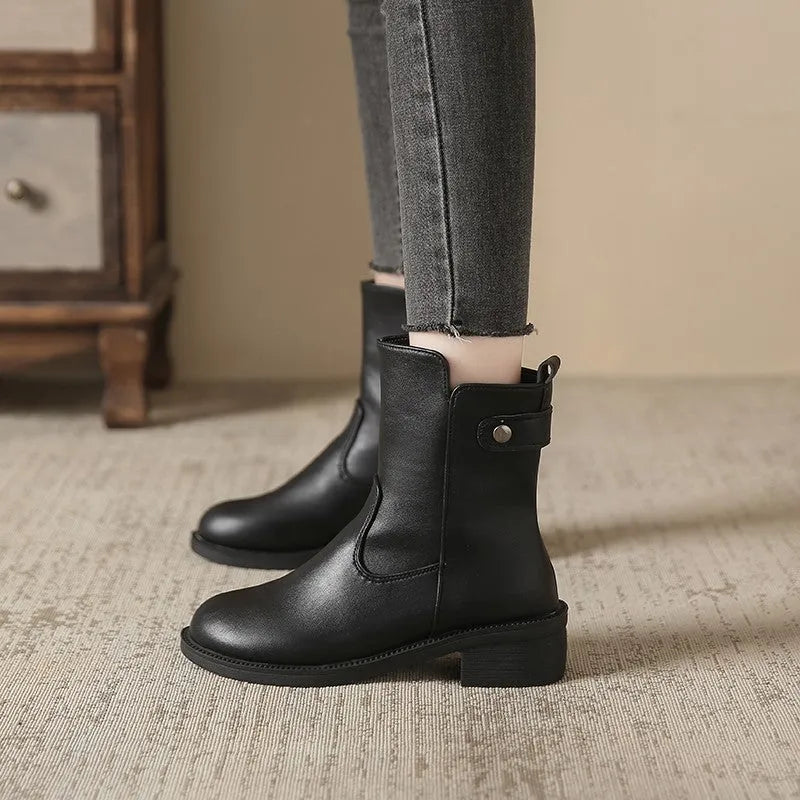 Black women's ankle boots with side zipper and round toe on low rubber heel