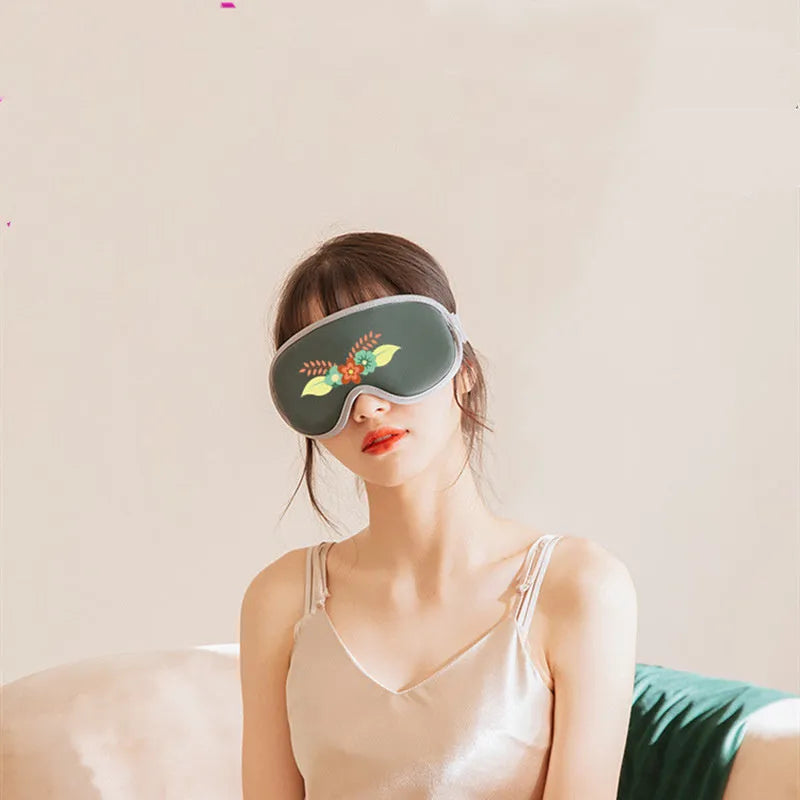 Portable Eye SPA Mask with suede shell in pink or green, showing USB port and dimensions of 93mm by 200mm.