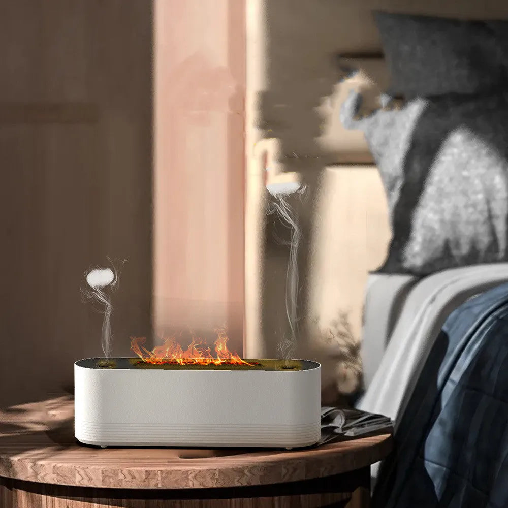 Black Flame Air ultrasonic humidifier diffuser emitting cool mist with a multi-colour LED flame light effect at its base.