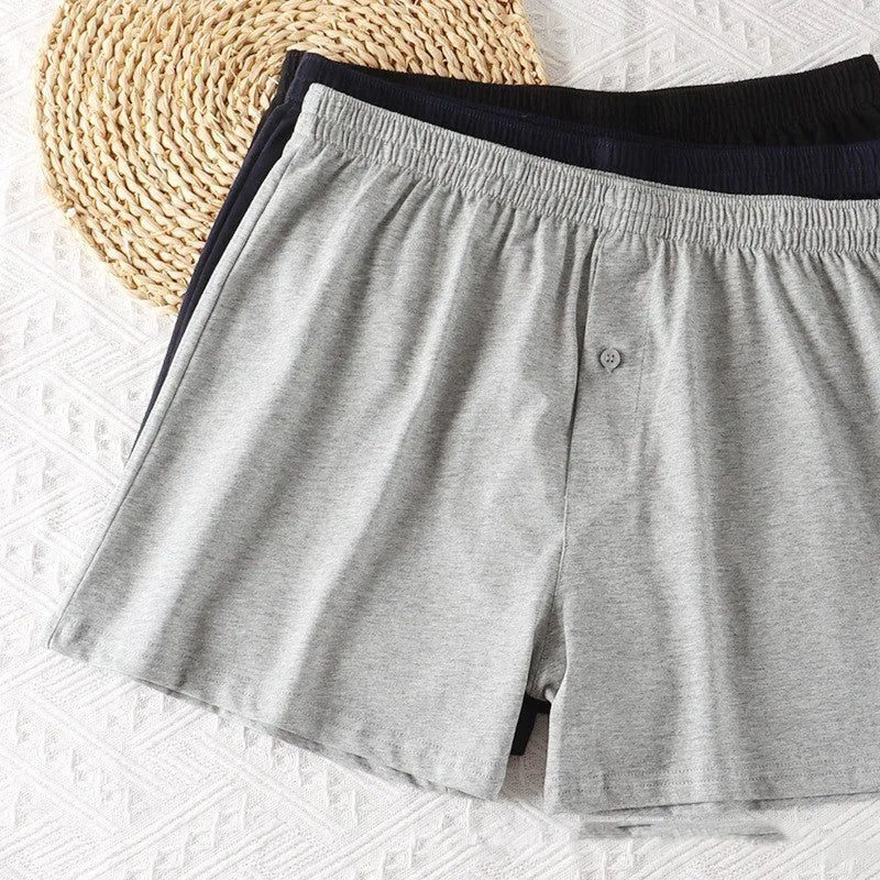 Men's high-waist loose fit cotton boxer shorts in black, shown flat.