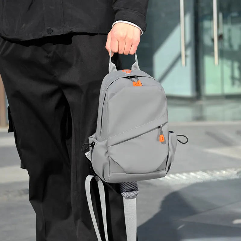 A black men's single shoulder crossbody bag made from polyester fabric.