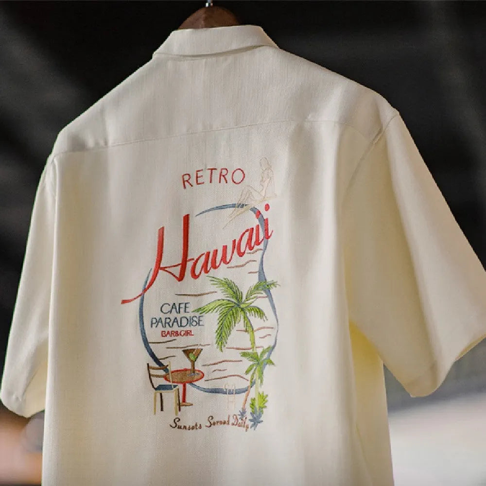 Light apricot men's Cuban collar shirt with an all-over bamboo and floral plant pattern print.