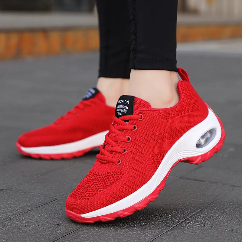 Women's red mesh sneakers with round toe and lace-up front, showing 3-5cm mid heel height