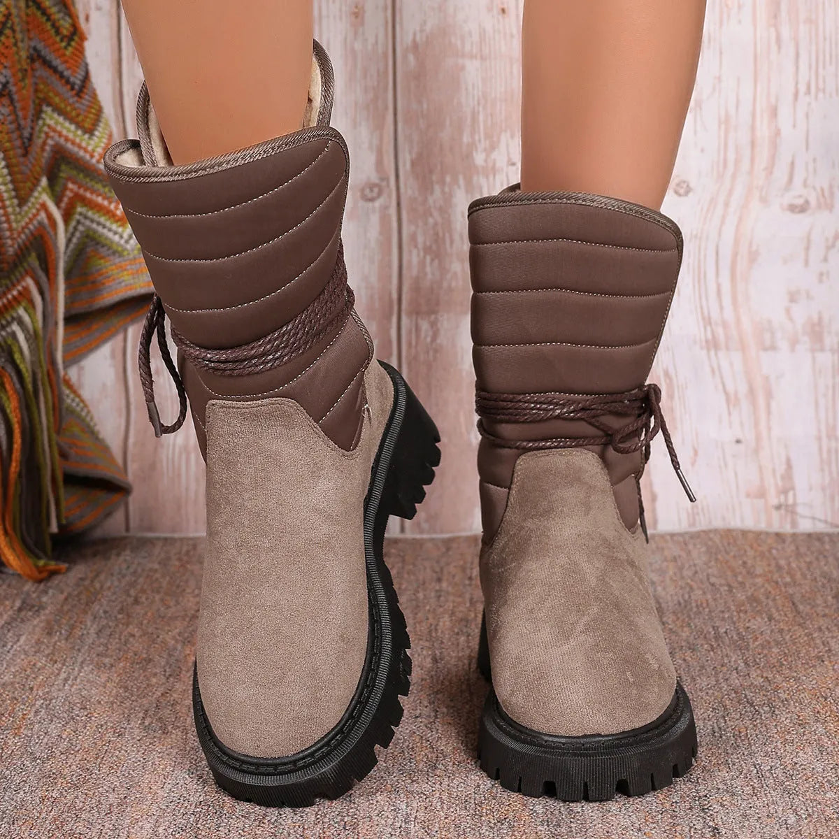 Women's black chunky heel snow boots with suede upper and lace-up design