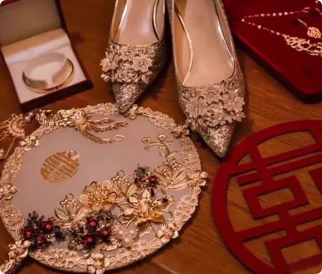 Champagne coloured women's wedding shoes with crystal rhinestones and a pointed toe, shown with a high heel.