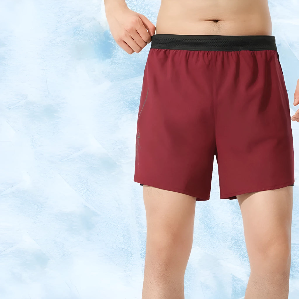 Men's solid-colour low-waist basketball shorts in polyester fabric