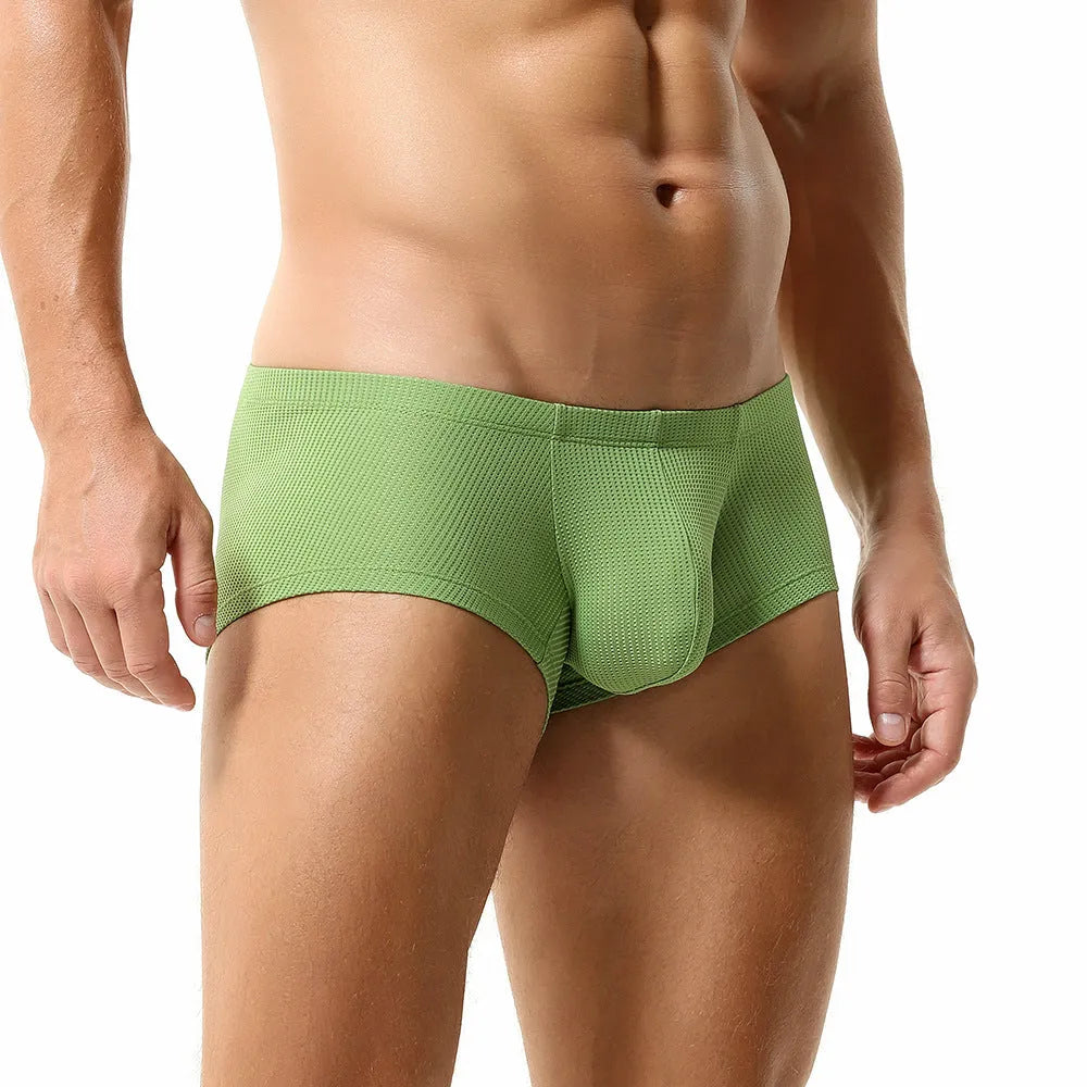 Men's low waist boxers in solid colour nylon fabric on a white background.