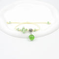 Glass dried flower bracelet with large 1.4cm beads containing real preserved flowers, in a hand-woven design.