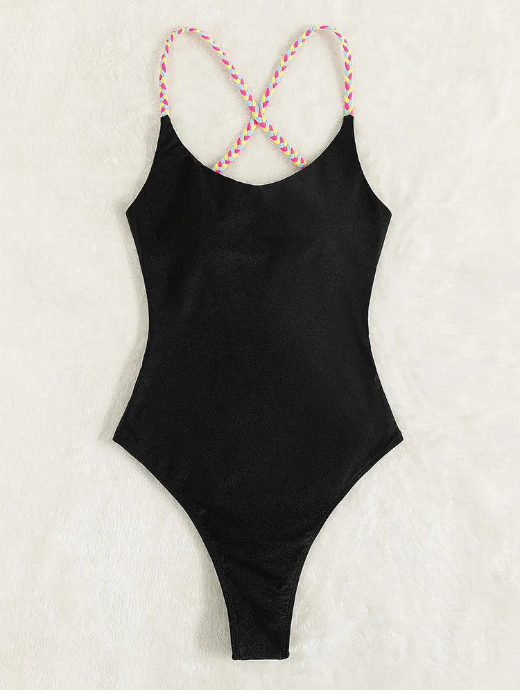 Black solid colour one-piece swimsuit with a backless and sleeveless design on a mannequin.