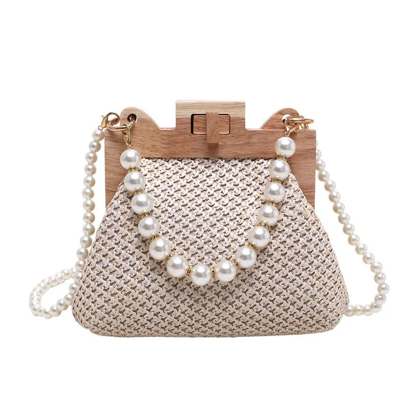 Women's straw woven shoulder bag with pearl chain strap in horizontal square shape