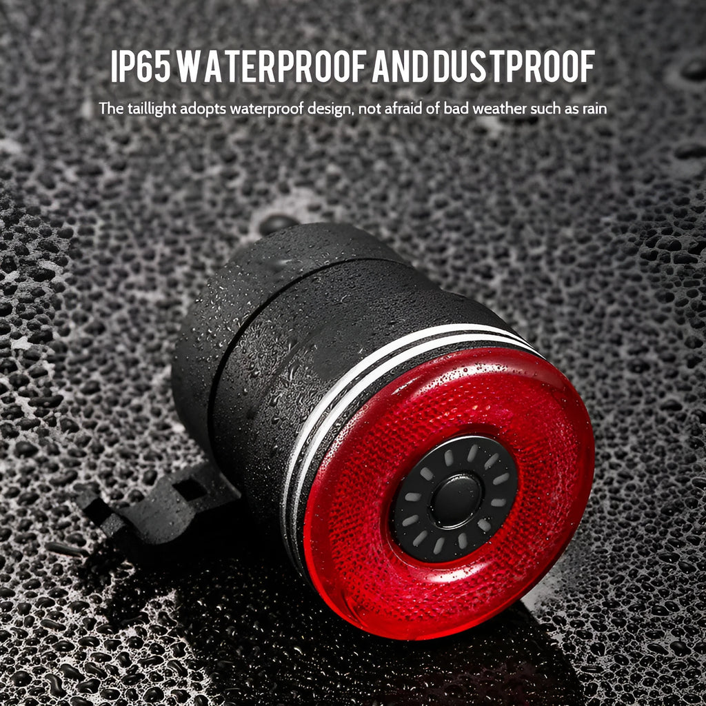 Black aluminium smart brake sensing USB rechargeable bicycle taillight showing compact size.