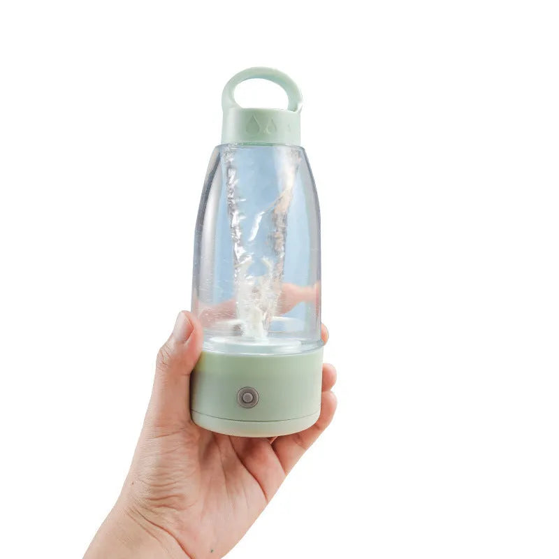 Automatic electric shaker bottle in green, pink, or white with USB charging port and handle.