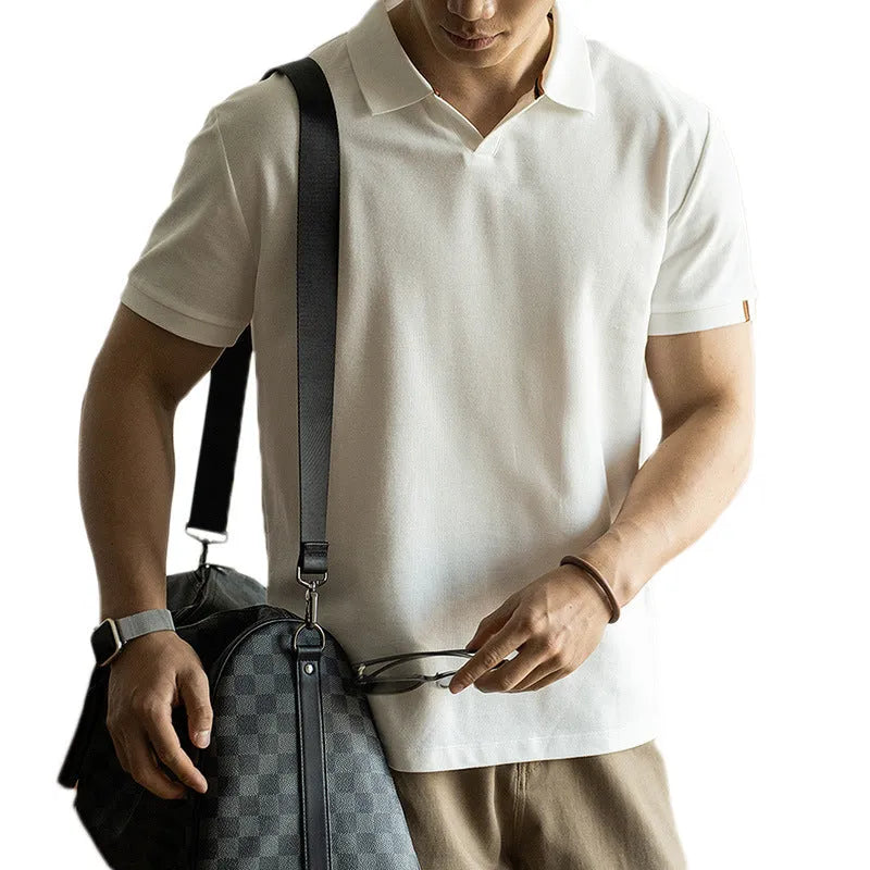 American-style light blue cotton blend short-sleeve polo shirt laid flat, showing regular fit and button placket.