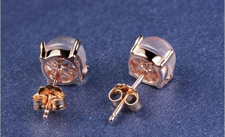 Women's rose gold drop shape stud earrings with crystal inlay detail