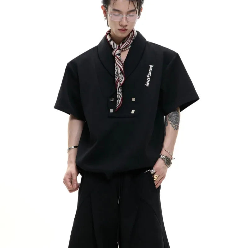 Men's dark grey cotton sports suit with metal-embellished V-neck jacket and matching shorts.