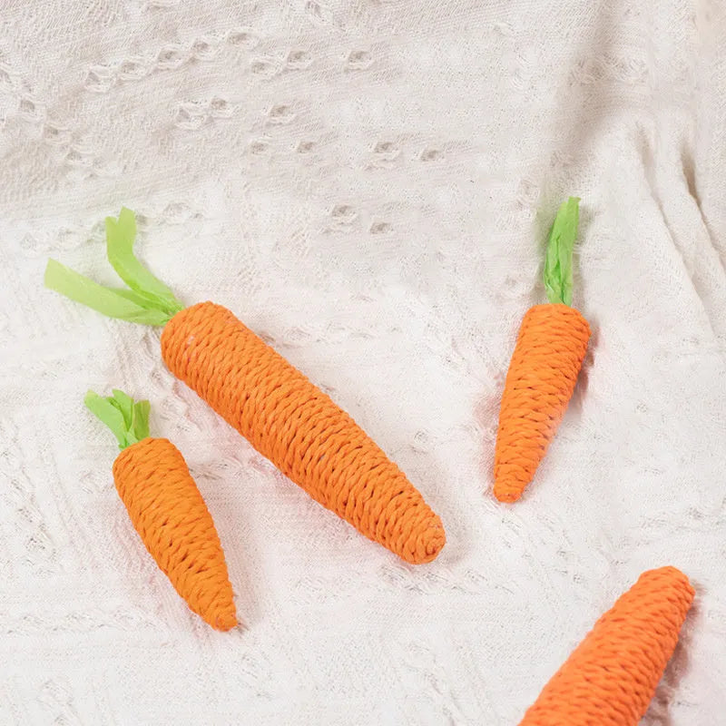 Interactive cat toy set with carrot paper toys, ringing stones, and textured grinding sticks for indoor play