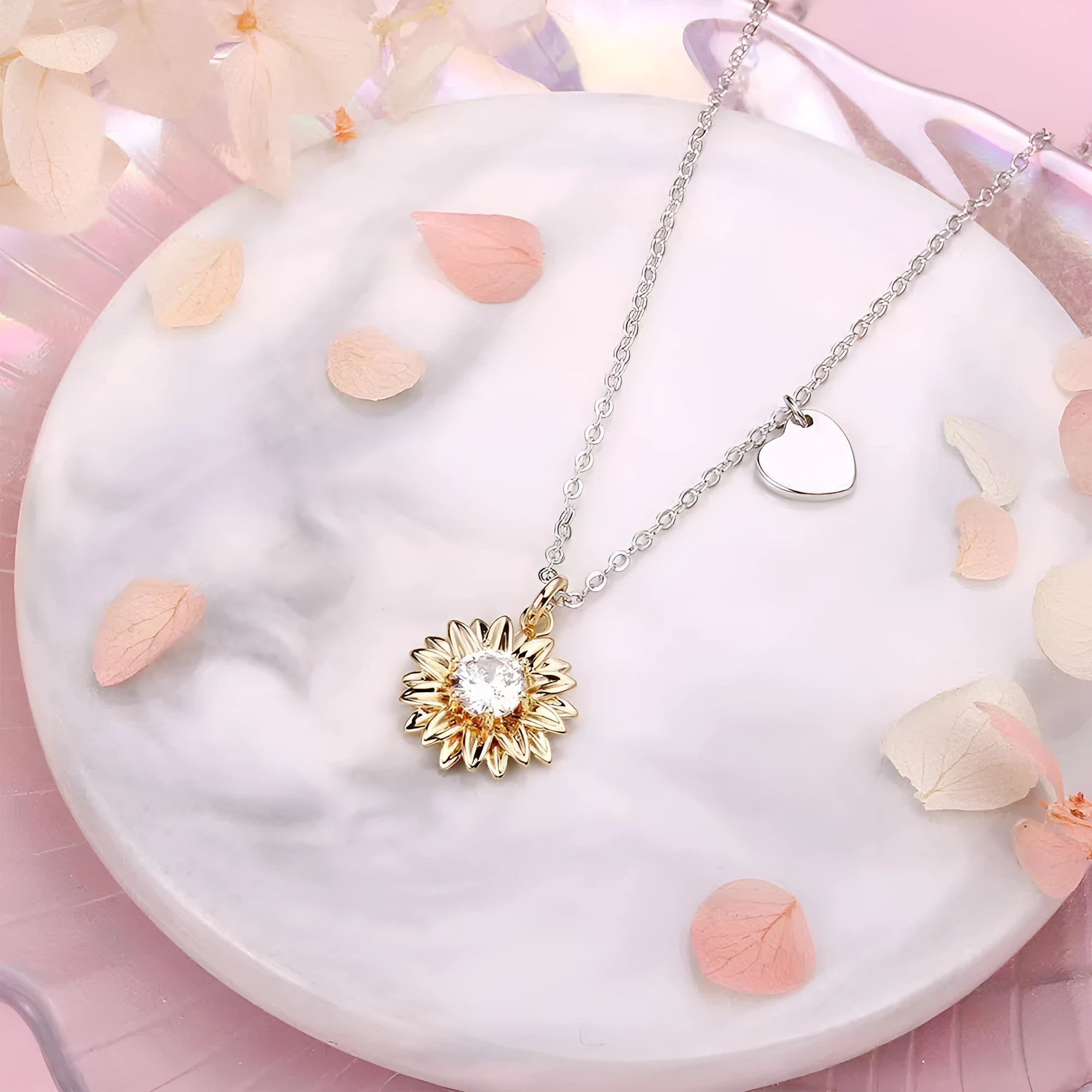 Women's sterling silver sunflower necklace with geometric petal pendant on a cross chain.