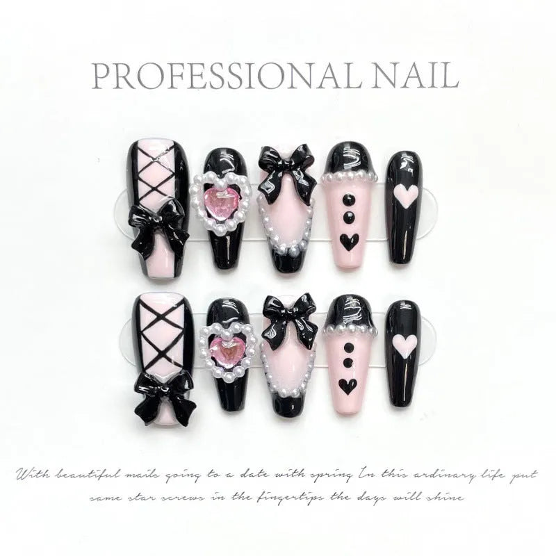 Black and pink peach heart hand-painted artificial nails with bow patterns in cat's eye finish