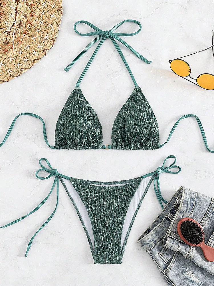 Women's green halter strap backless swimsuit with three-point design and matching shorts