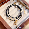 Blue sand stone three-ring multi-layer bracelet for women on a wrist.