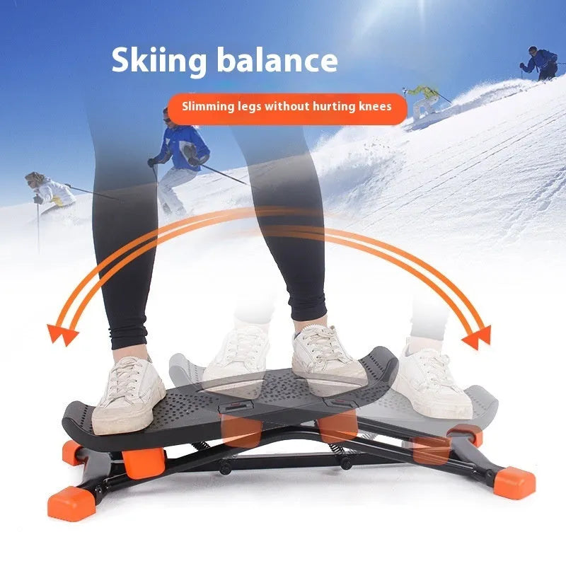 Black foldable mini fitness skiing machine JS101A with elastic hand straps on a home floor.