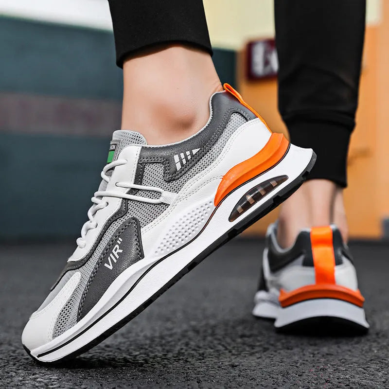 Men's grey breathable mesh casual shoes with a round toe and middle-top height on a white background.
