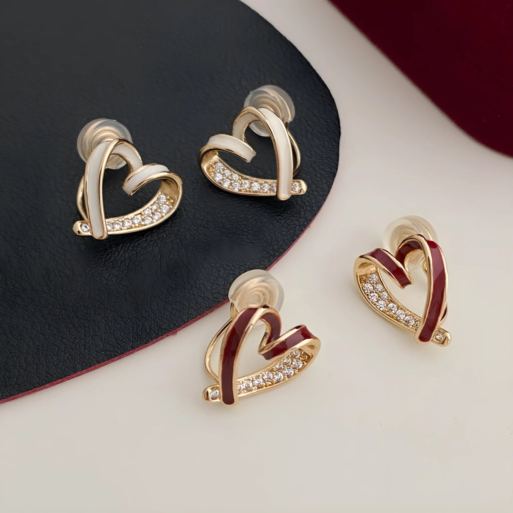 Fashion micro-set zircon asymmetric earrings in copper heart shape with love motif, available in red or white as ear clips or studs