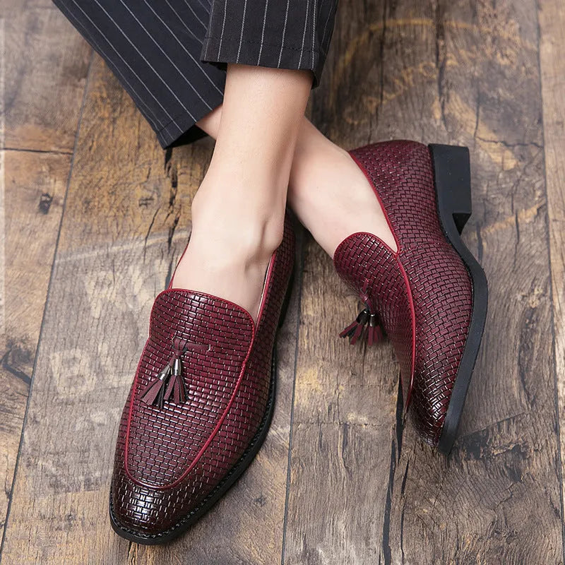 Men's black slip-on shoes with pointed toe and tassel decoration on artificial PU upper