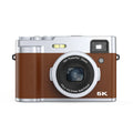 Black 5K HD digital camera with front and rear lenses, optical viewfinder, and 2.88-inch screen on a table.