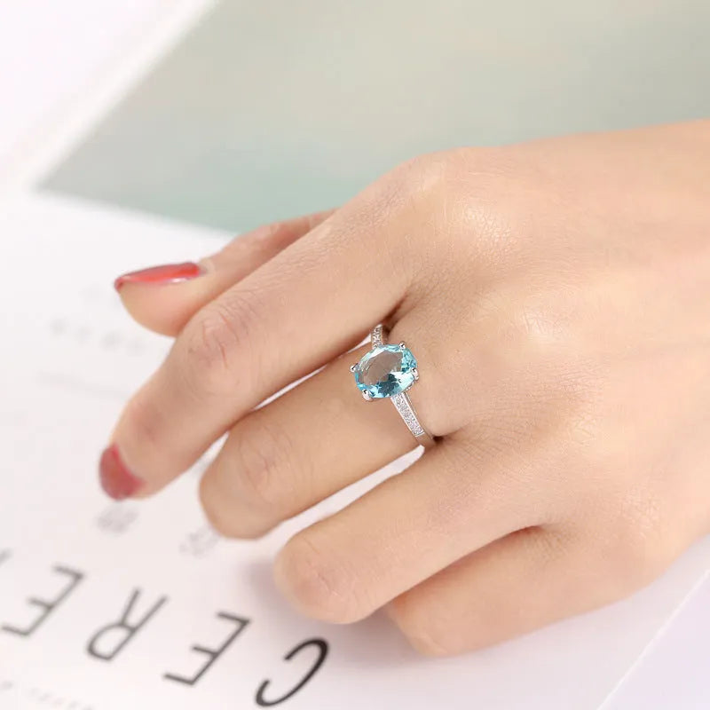 Ocean blue zircon copper ring with geometric shape and electroplated finish in women's sizes No 6 to No 10