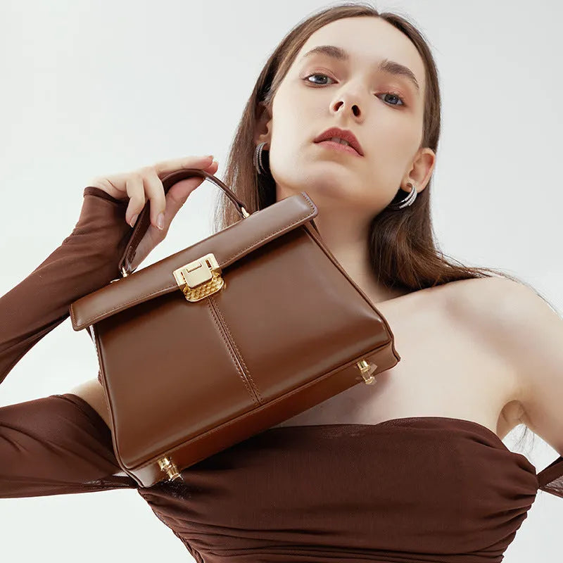 Genuine leather women's shoulder bag in horizontal square shape with adjustable strap.
