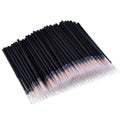 Pack of 100 black disposable eyeliner brushes with fine pointed tips and plastic sleeves