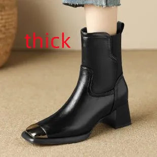 Brown leather women's Martin boots with a high heel and side zipper on a white background.