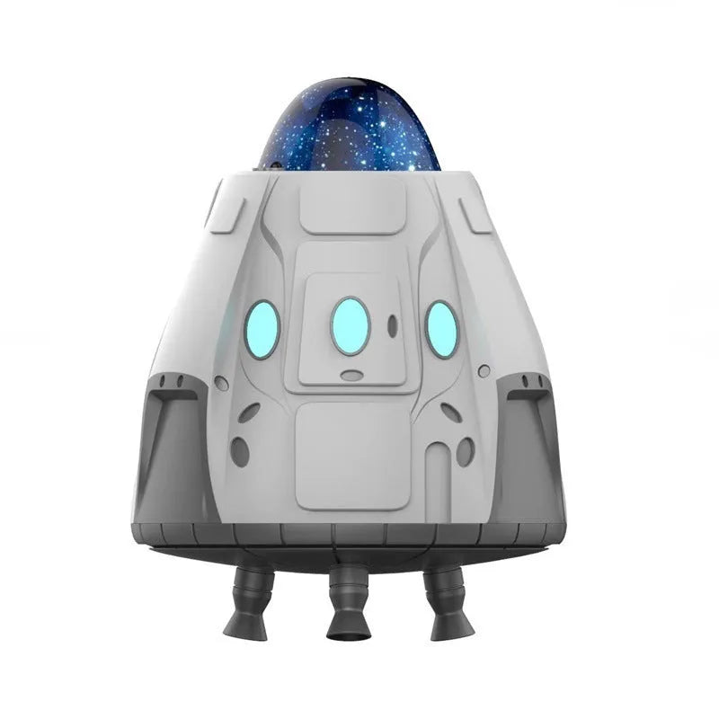 White space capsule Bluetooth ambience light projecting green northern lights on a dark wall.