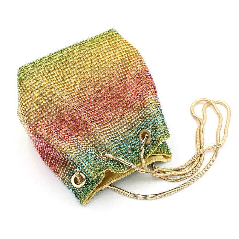 Sparkling rhinestone bucket handbag with a soft, unstructured shape on a neutral background.